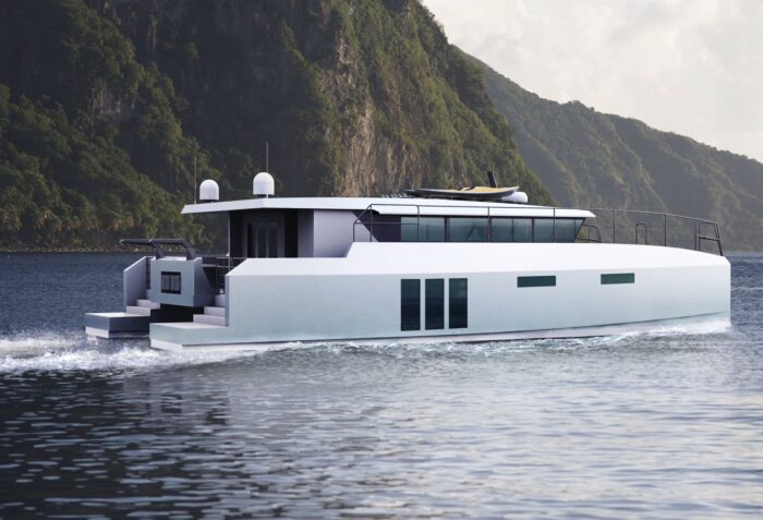 Archipelago catamaran cruising off a beautiful island